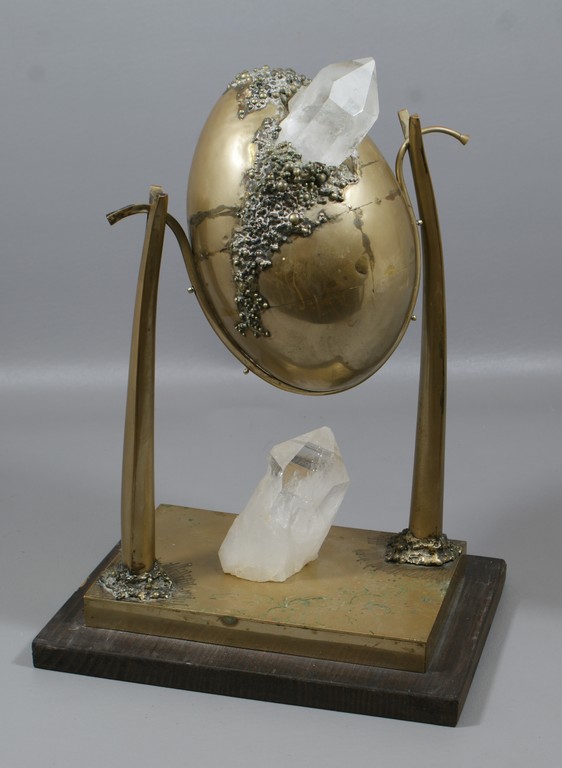 Appraisal: Brass and crystal egg shaped sculpture on wood base dripped