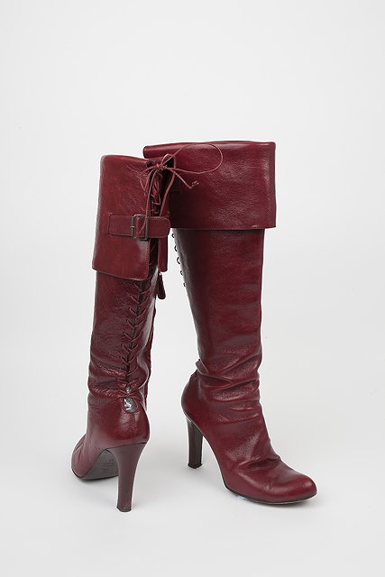 Appraisal: A pair of red leather Alexander McQueen high heeled boots