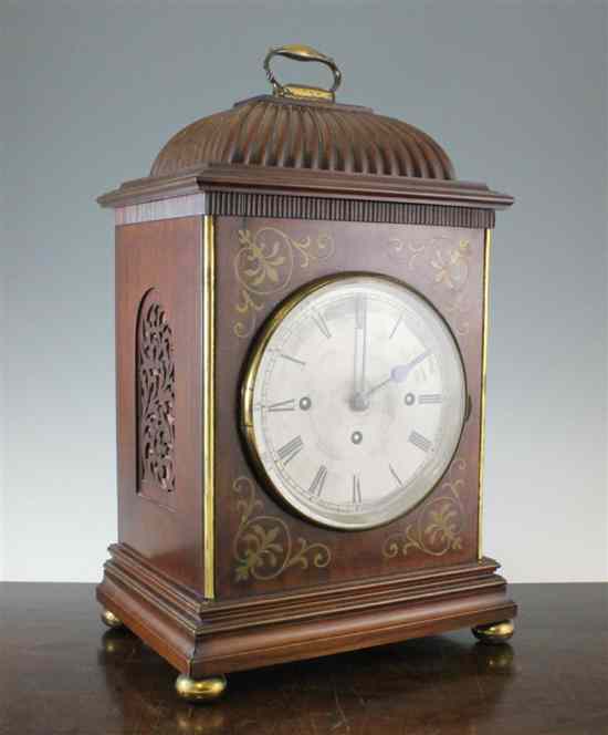 Appraisal: A Regency style brass inset mahogany chiming mantel clock with