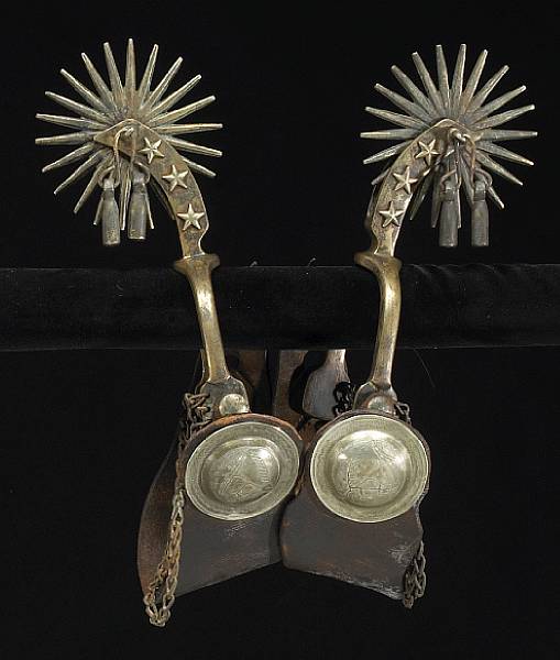 Appraisal: A pair of unusual brass spurs in the style of