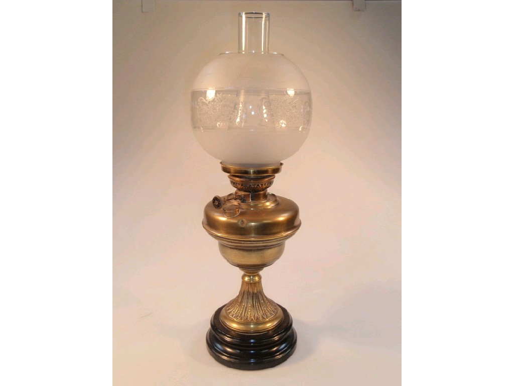 Appraisal: A thC brass oil lamp with an acid etched and