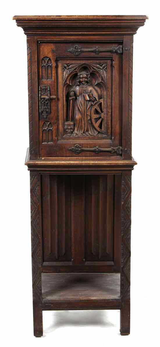 Appraisal: A Renaissance Revival Carved Cabinet on Stand having a molded