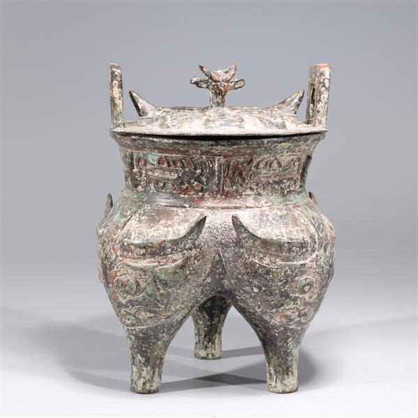 Appraisal: Chinese archaistic bronze metal tripod censer with intricately molded and