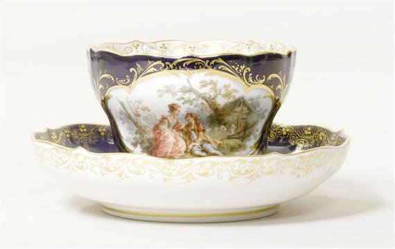 Appraisal: CUP AND SAUCER WITH WATTEAU MOTIFS MEISSEN CIRCA Cobalt blue