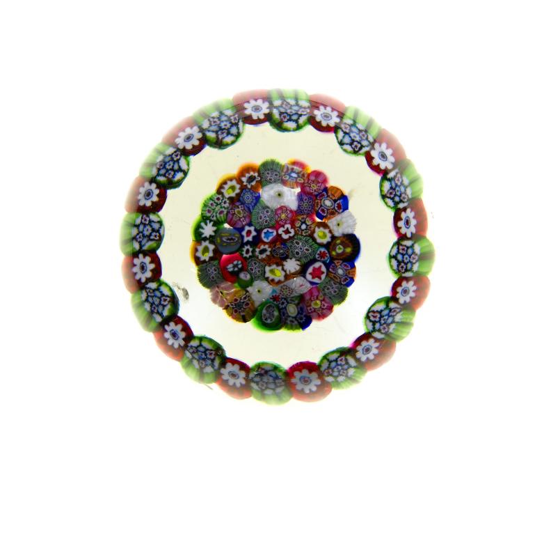 Appraisal: A BACCARAT GARLANDED MILLEFIORE PAPERWEIGHT with a central cluster of