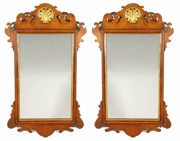 Appraisal: A pair of George II style parcel-gilt mahogany mirrors height