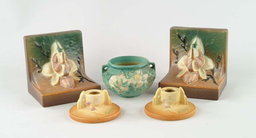 Appraisal: FIVE PIECES OF ROSEVILLE POTTERY Pair of Magnolia bookends matte