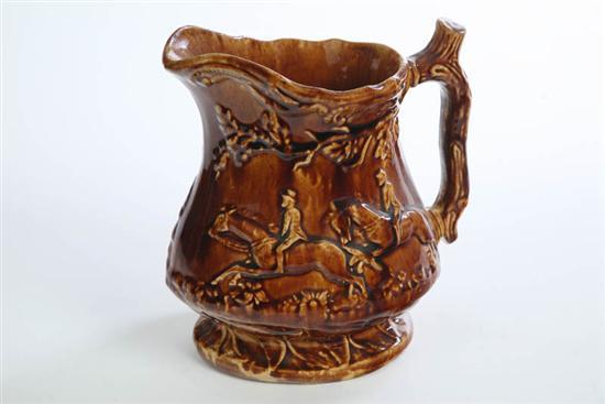 Appraisal: ROCKINGHAM PITCHER Embossed hunt scene with branch handle Ex George