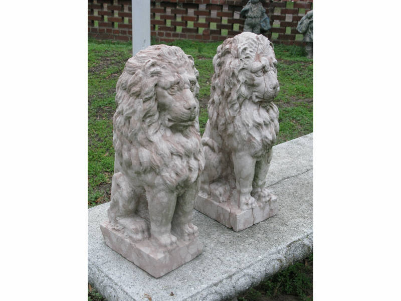 Appraisal: Pair of Carved Stone Seated Lions attractive mottled rose and