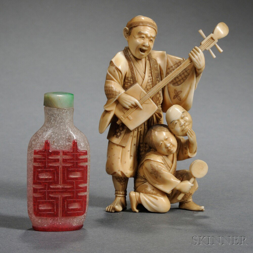 Appraisal: Two Miscellaneous Items Asia a Japanese ivory figural group depicting