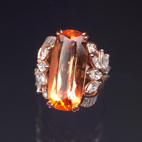 Appraisal: TOPAZ AND DIAMOND Elegant imperial topaz and diamond ladies ring