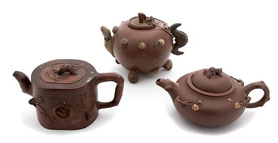 Appraisal: Three Japanese Terracotta Teapots Height of largest inches Three Japanese