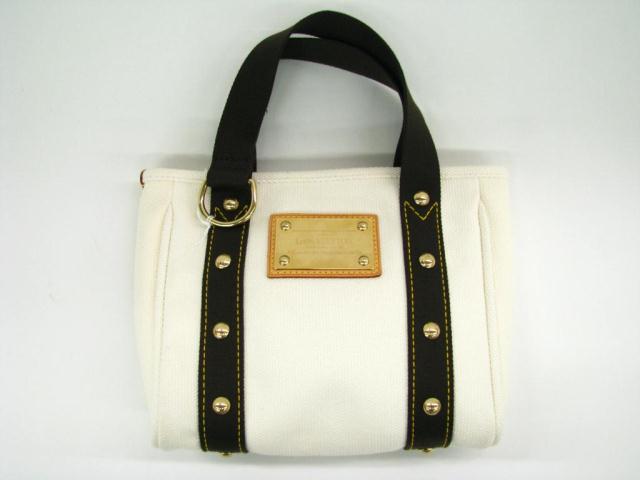 Appraisal: Louis Vuitton ''Inventeur'' white canvas shopper tote with brown leather