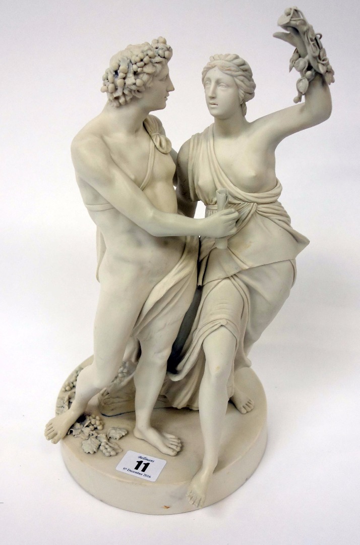 Appraisal: A Victorian Parian bacchanalian figure group beside a plinth and