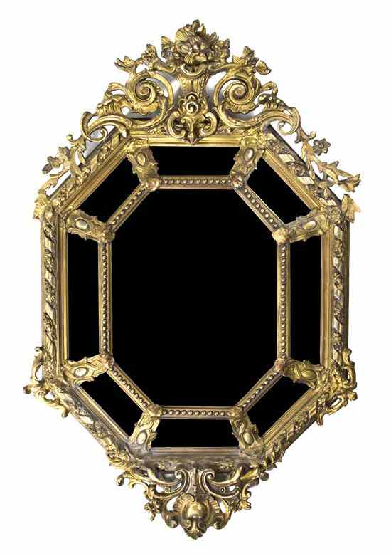 Appraisal: A Continental Giltwood Mirror having an elongated octagonal plate within