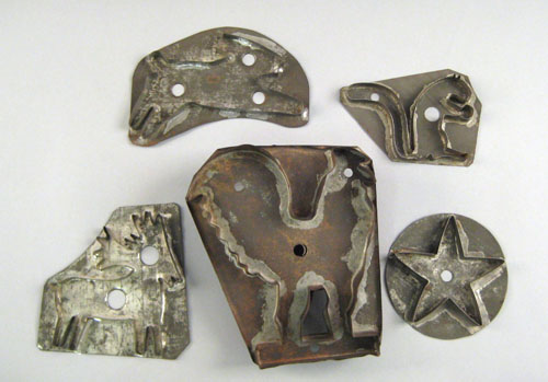 Appraisal: Five tinned sheet iron cookie cutters th c in the