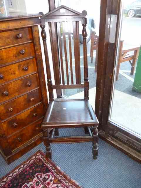 Appraisal: A PAIR OF ANTIQUE HIGH BACKED LATH BACK CHAIRS with