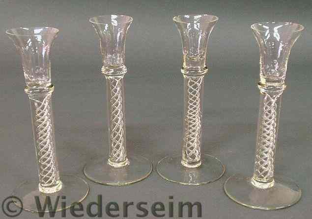 Appraisal: Set of four swirl glass candlesticks h