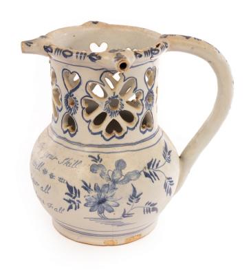 Appraisal: An English Delftware puzzle jug inscribed with a poem cm