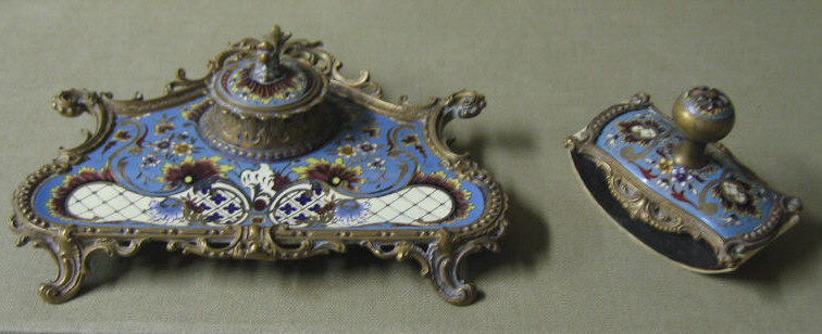 Appraisal: TWO-PIECE FRENCH CHAMPLEVE ENAMEL DESK SET Rococo style brass encrier