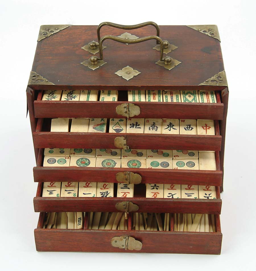 Appraisal: CASED IVORY AND WOOD MAH-JONG SET Mahogany case has five