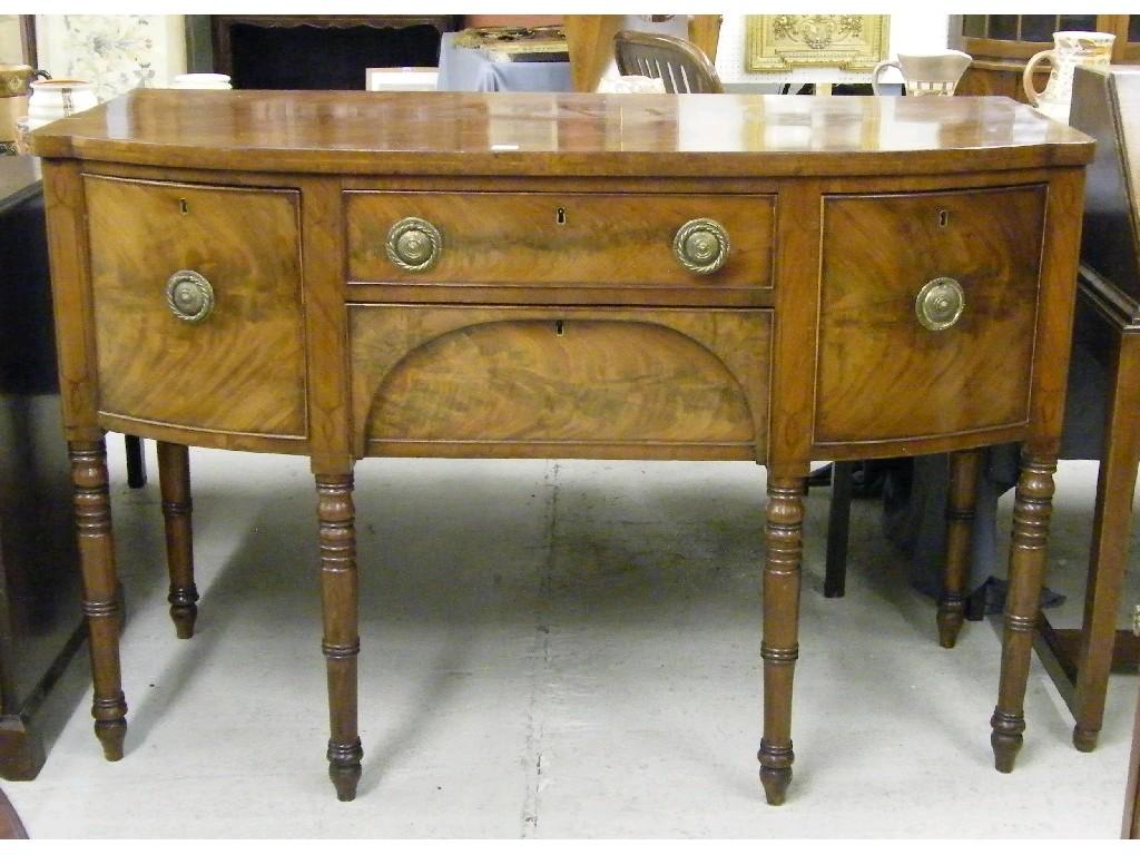 Appraisal: Small late Regency flamed mahogany bow fronted sideboard the shaped