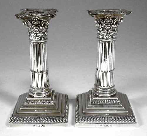 Appraisal: A pair of Edward VII silver squat pillar candlesticks with