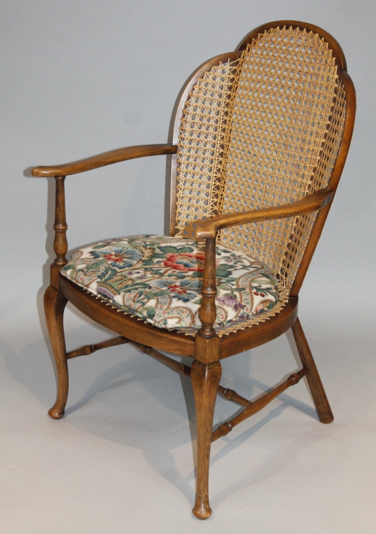 Appraisal: A 's berger elbow chair with a pierced back and