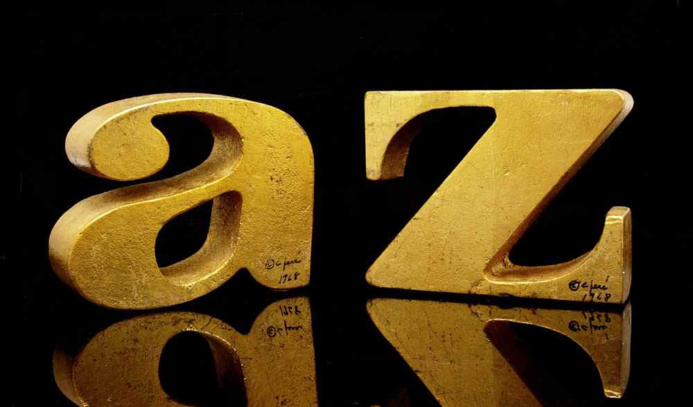 Appraisal: CURTIS JERE SIGNED A-Z BOOKENDS Heavy cast metal with gilt