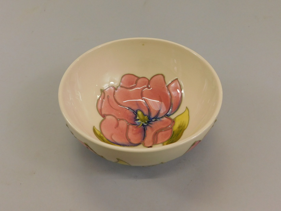 Appraisal: A Moorcroft bowl decorated with pink flowers and green leaves