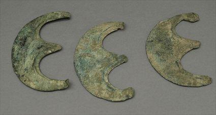 Appraisal: Three Luristan Double Crescent-Form Axe Fragments