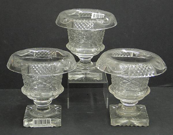 Appraisal: A set of three Anglo Irish style cut glass urns