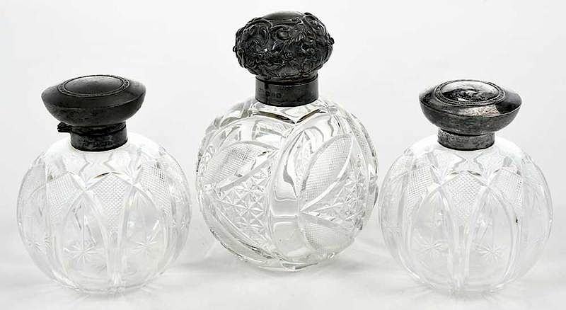 Appraisal: Three Cut Glass Perfumes English Silver Caps English late th