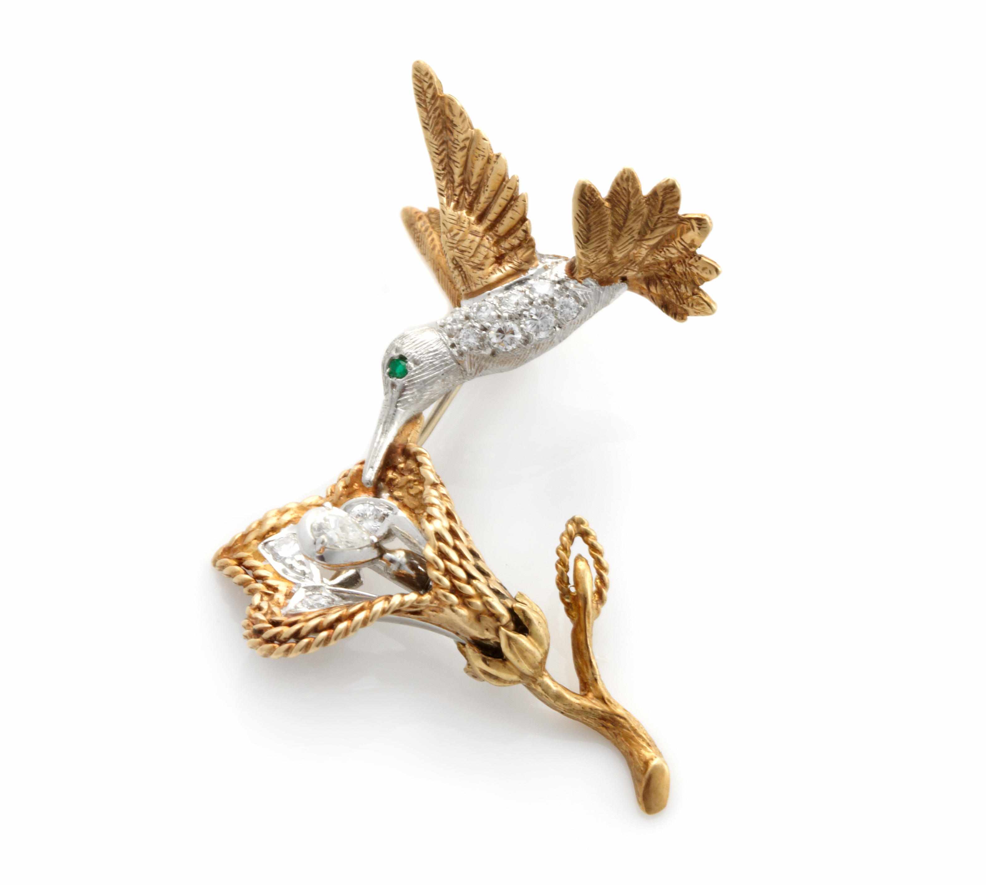 Appraisal: A diamond green stone and bicolor gold articulated hummingbird brooch