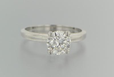 Appraisal: A Solitaire Diamond Ring Simple platinum mounting features an approx