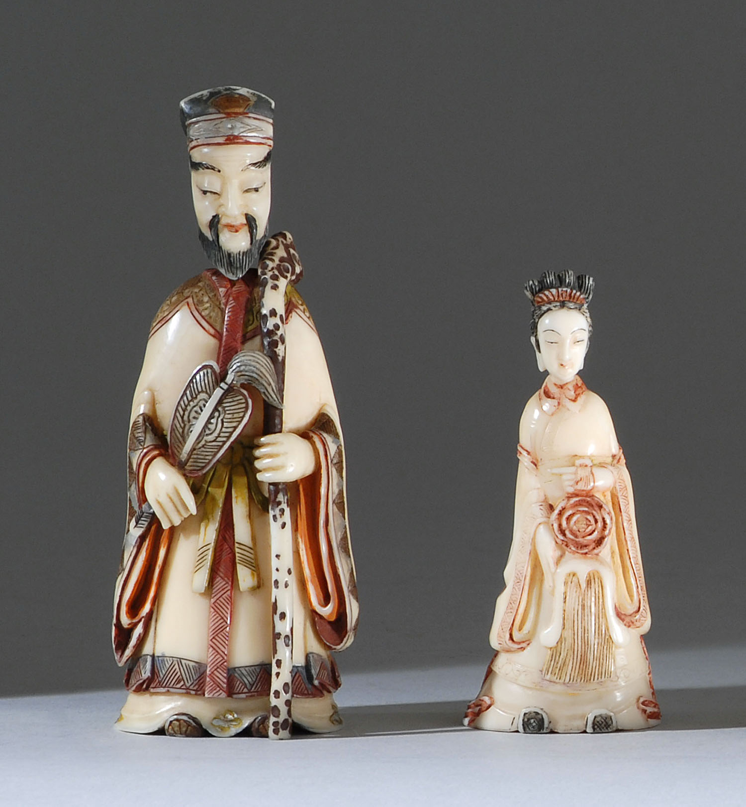 Appraisal: TWO FIGURAL IVORY SNUFF BOTTLES Circa Woman in floral-decorated robe