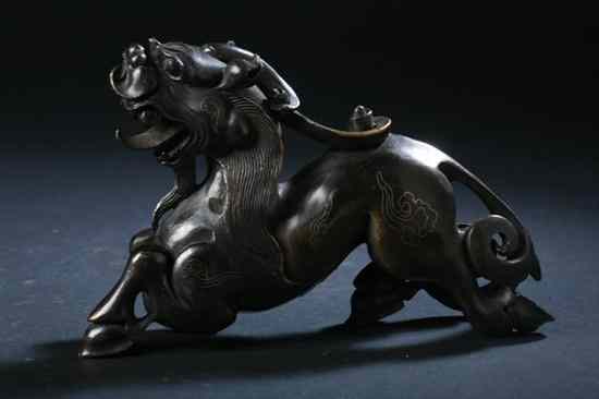 Appraisal: CHINESE SILVER INLAID BRONZE FIGURE OF QILIN - in long