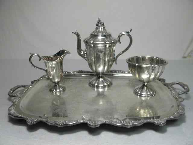 Appraisal: Four piece Victorian silver plate tea service Includes Meriden Britannia