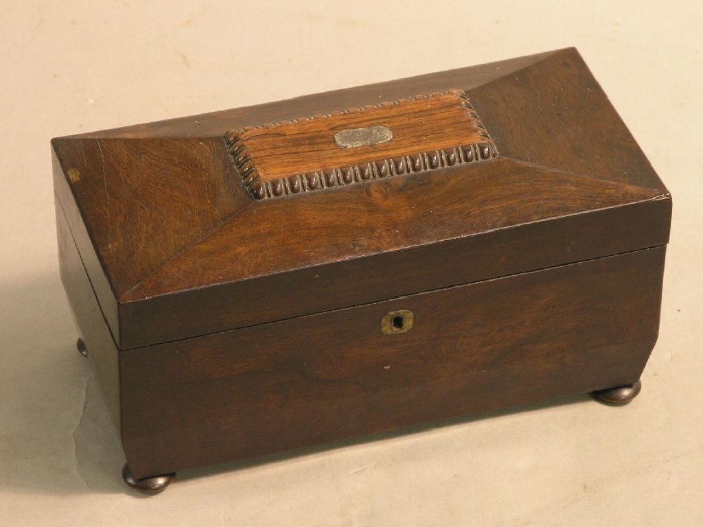 Appraisal: A Victorian rosewood tea caddy with enclosed cannisters in