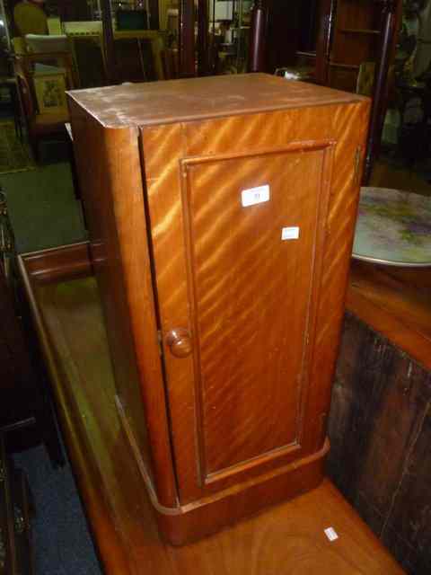 Appraisal: A VICTORIAN SATIN WALNUT POT CUPBOARD enclosed by single panel