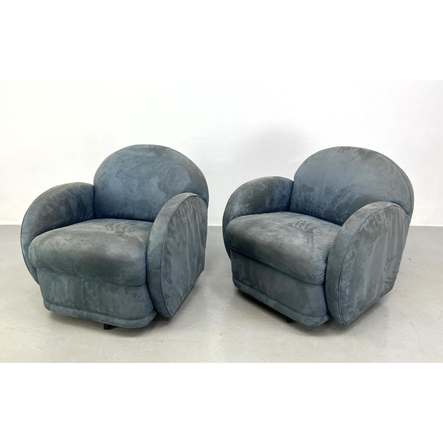 Appraisal: Pr PRECEDENT Blue Swivel Lounge Chairs Arched upholstered back and