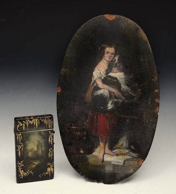 Appraisal: A VICTORIAN OVAL PAPIER MACH PAINTING of a girl holding