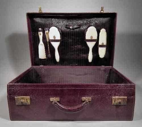 Appraisal: An early th Century Ladies maroon leather dressing case retailed