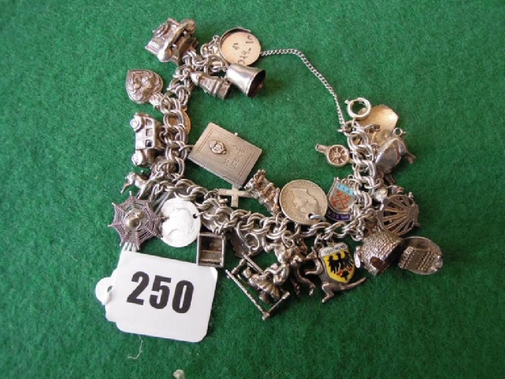 Appraisal: A charm bracelet many pieces stamped silver