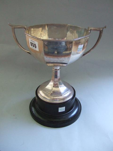 Appraisal: A silver large trophy cup of twin handled octagonal form