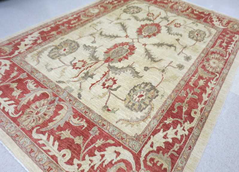 Appraisal: HAND KNOTTED ORIENTAL CARPET Pakistani Persian overall stylized floral design