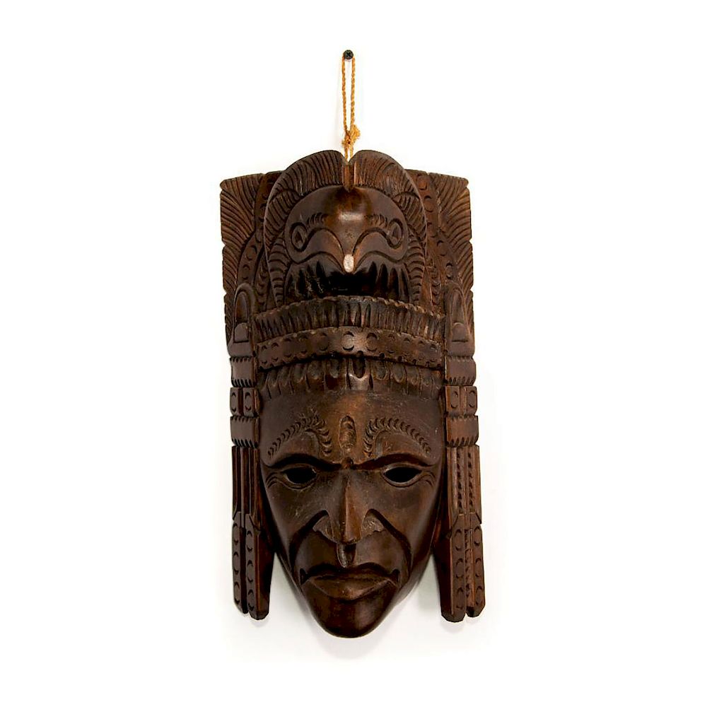 Appraisal: INDIGENOUS AMERICAN STYLE CARVED WOOD MASK Intricately carved symmetrical geometric