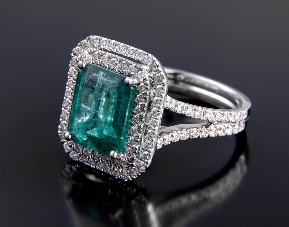 Appraisal: Platinum Emerald and Diamond Ring prong-set rectangular step cut natural