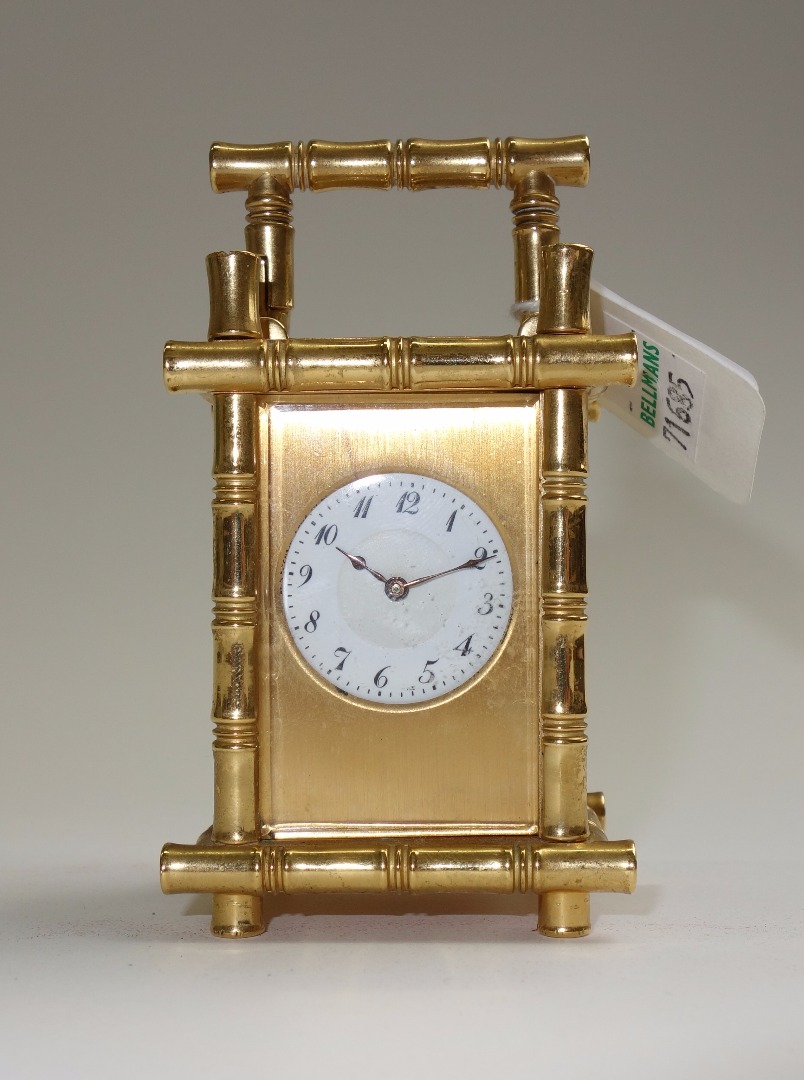 Appraisal: A miniature brass cased carriage clock early th century the