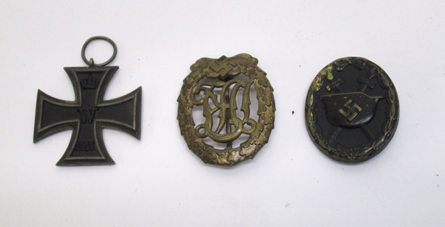 Appraisal: THREE GERMAN BADGES Imperial German iron cross double sided having